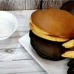 A photo of several pairs of Japanese dorayaki with custard and red bean fillings.