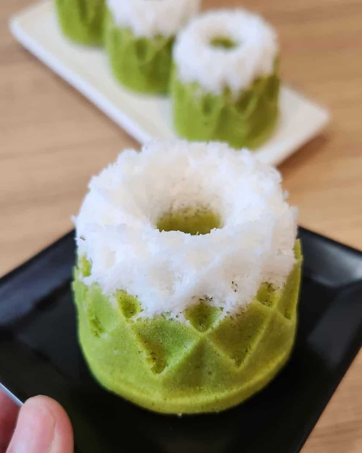 A plate of beautiful putu ayu pandan.