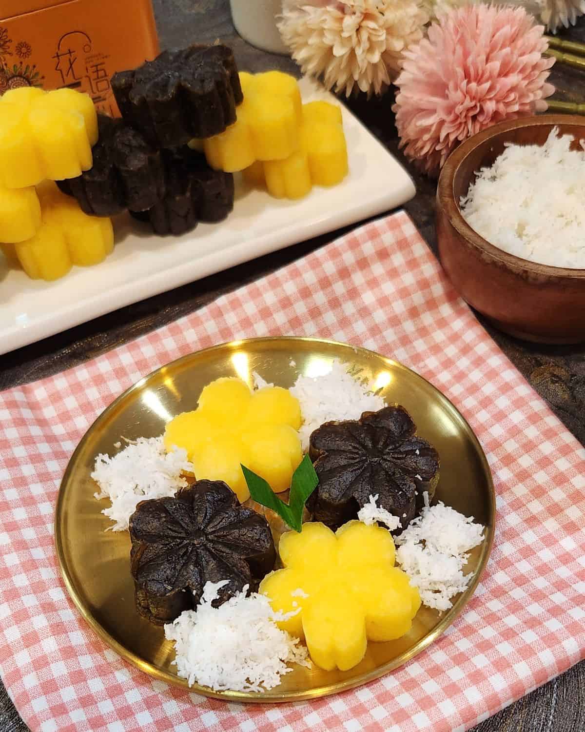A golden plate of getuk lindri with grated coconut. 