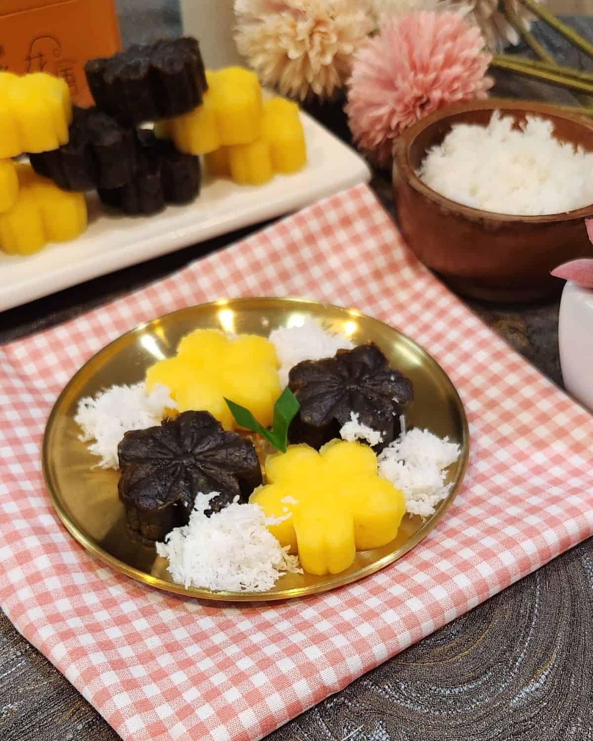 A golden plate of getuk lindri with grated coconut.