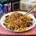 A plate of Mie Goreng, Indonesian stir fried noodles with chopsticks.