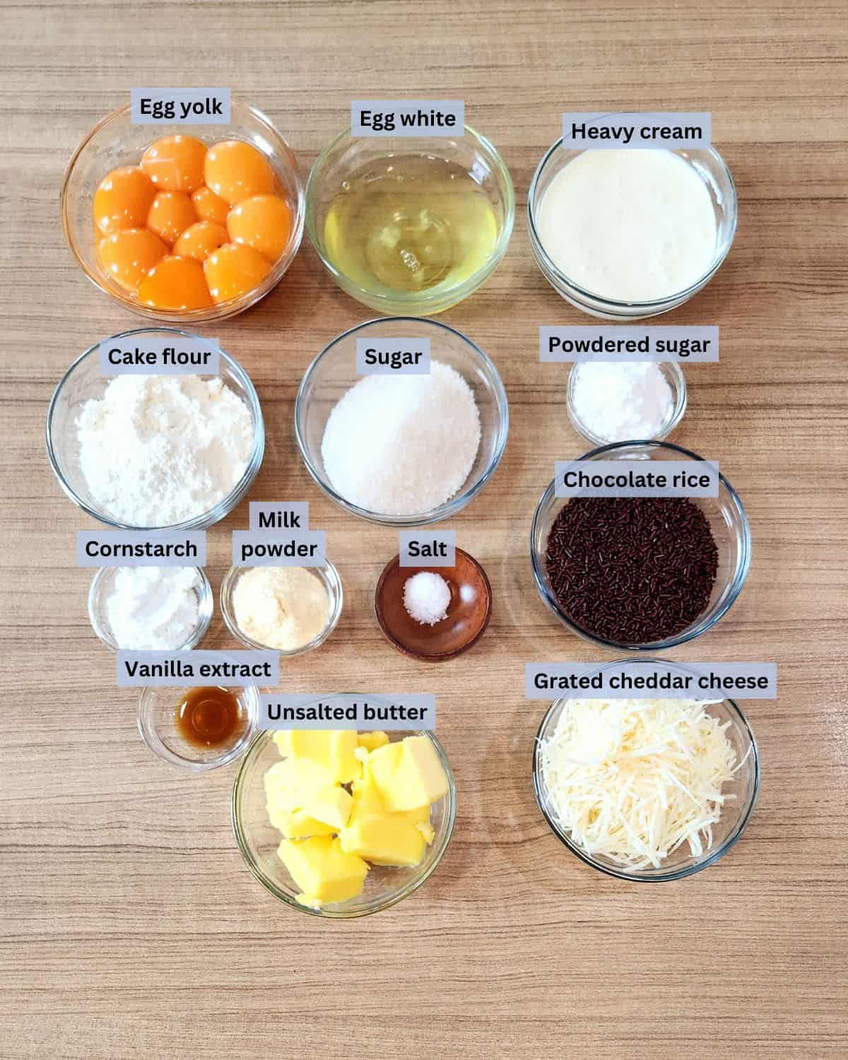 Ingredients for mini sponge cakes with labels.