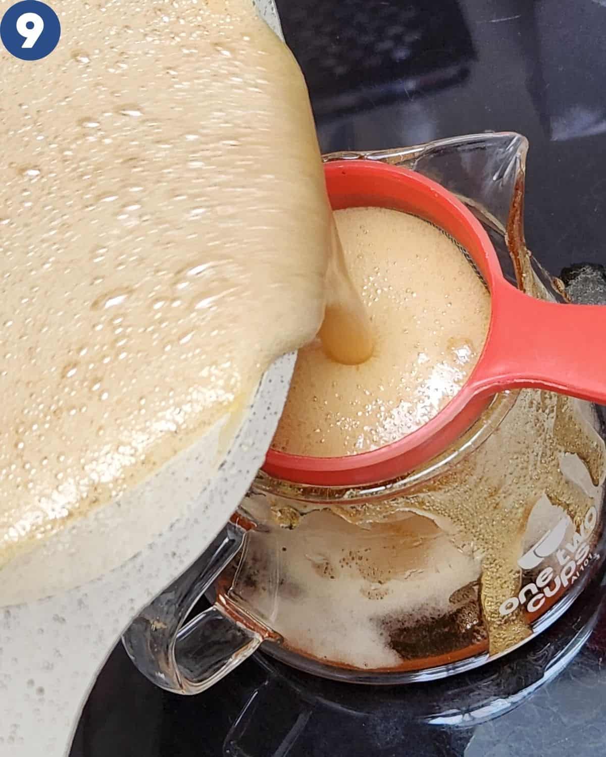 Pouring the syrup through a strain into a container.