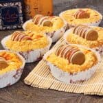 A few of Korean sausage bread on a bamboo tray.
