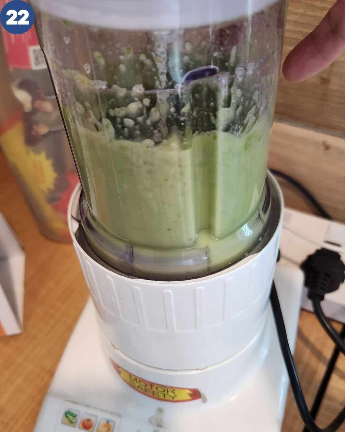 Processing the green chili in a food processor.