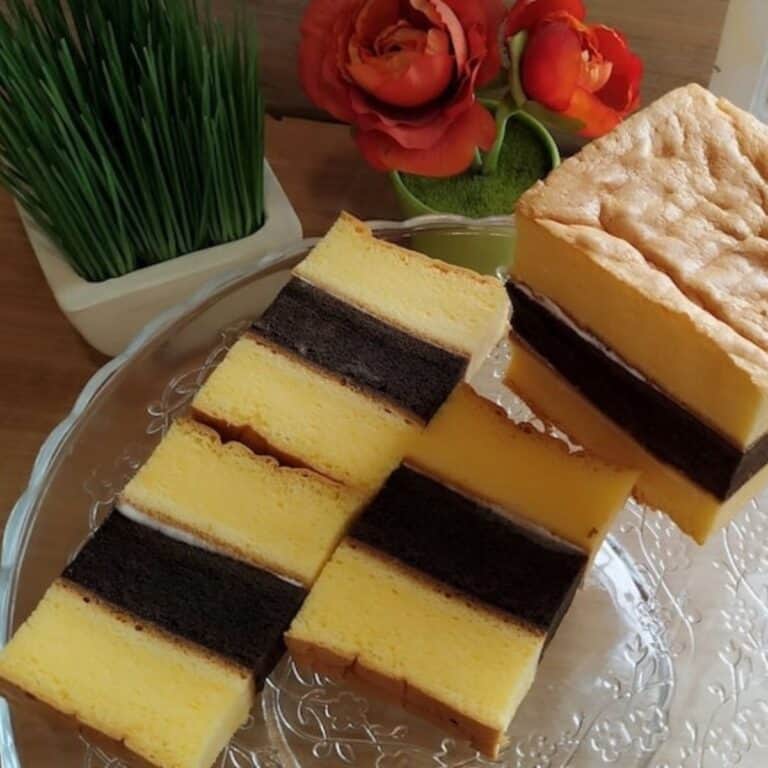 A few slices of Lapis Surabaya on a glass tray.