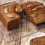 Copycat starbucks banana bread in slices on a wire rack.