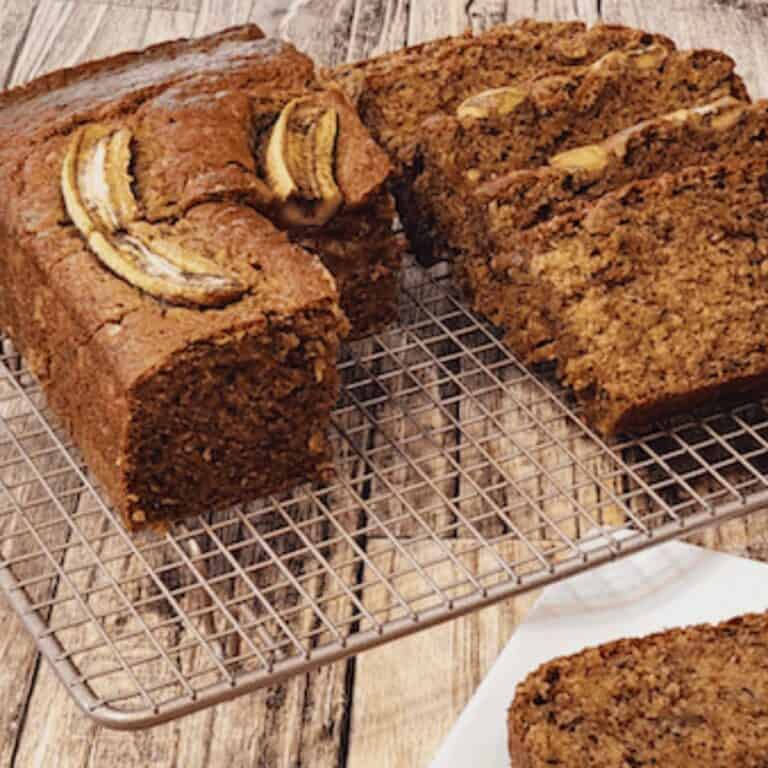 Copycat starbucks banana bread in slices on a wire rack.
