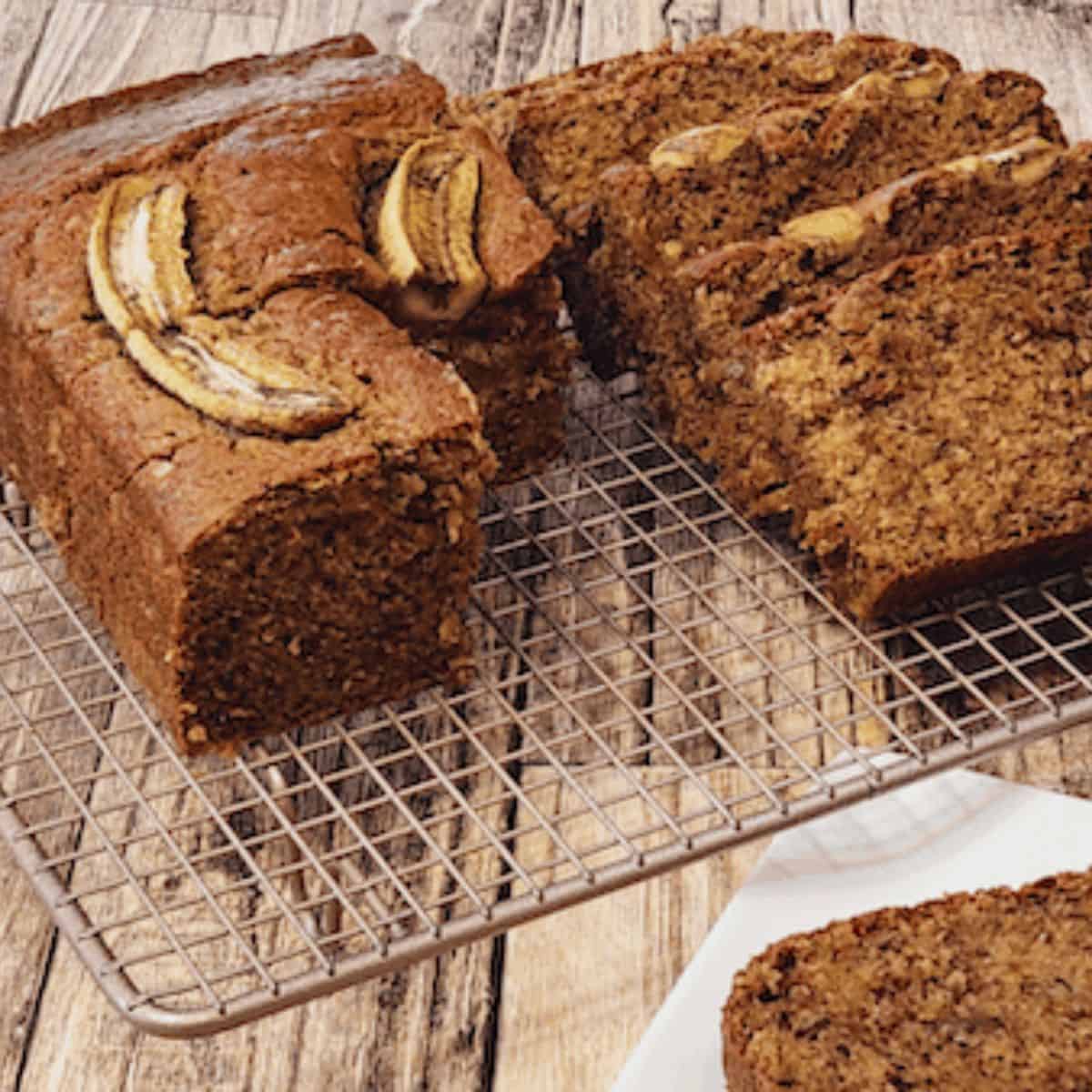 Copycat starbucks banana bread in slices on a wire rack.