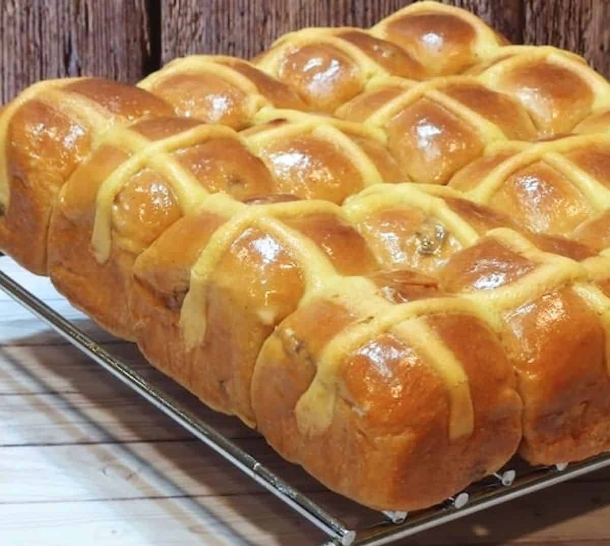 Hot Cross buns loaf on a steel rack.